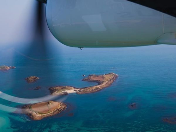 view from a plane window of the Isle of Scilly