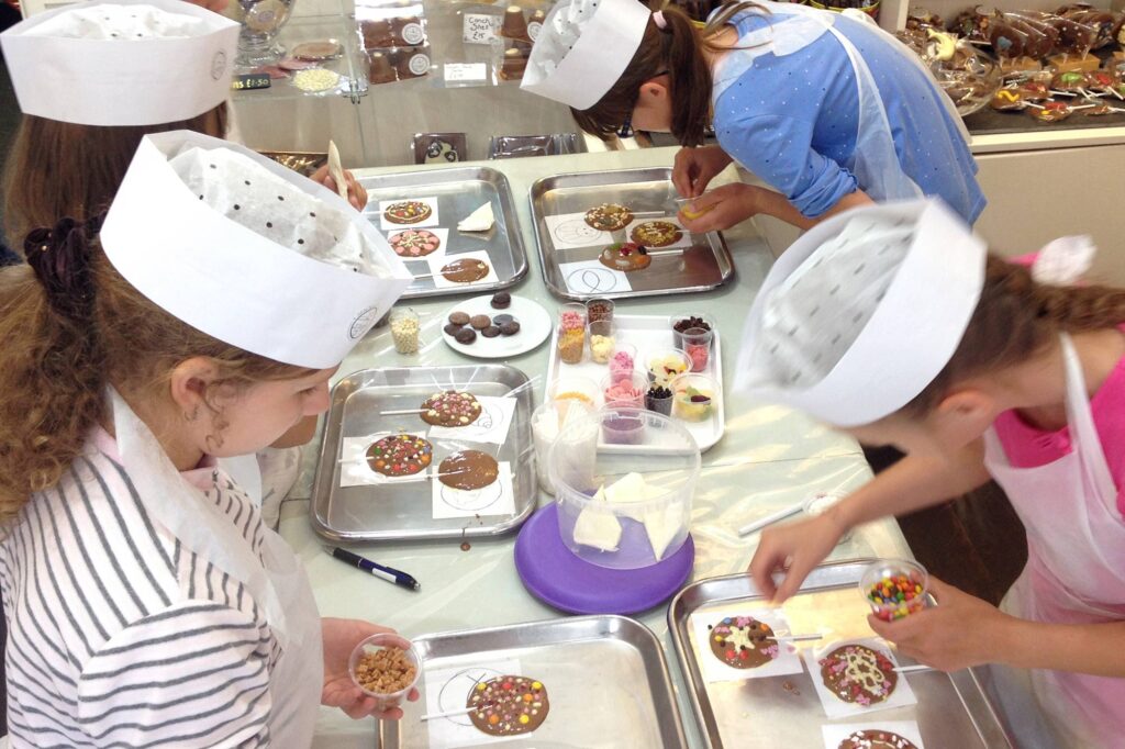 Children taking part in a chocolate making workshop during Easter in St Ives