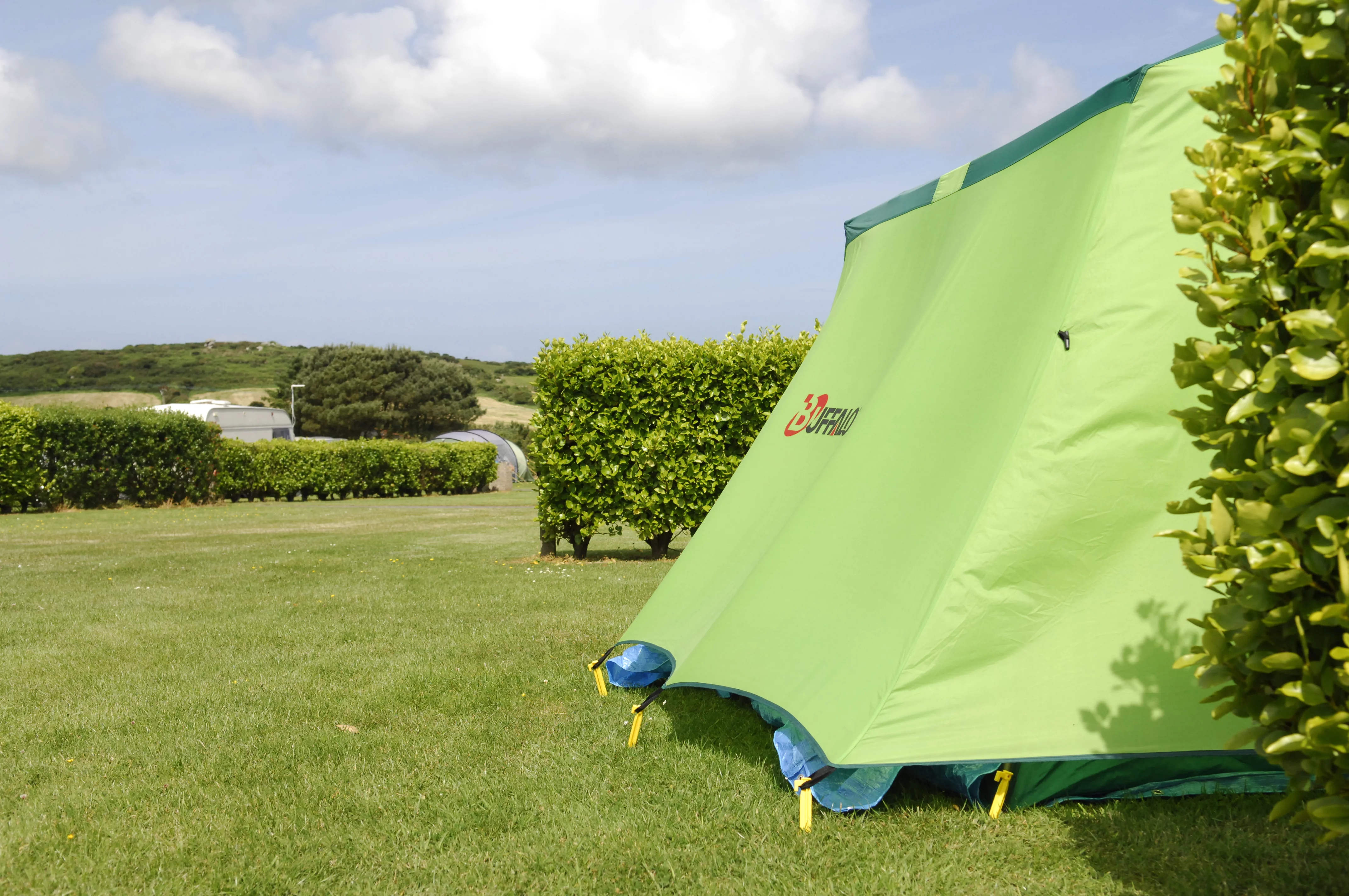 Side view of green tent pitched at Polmanter