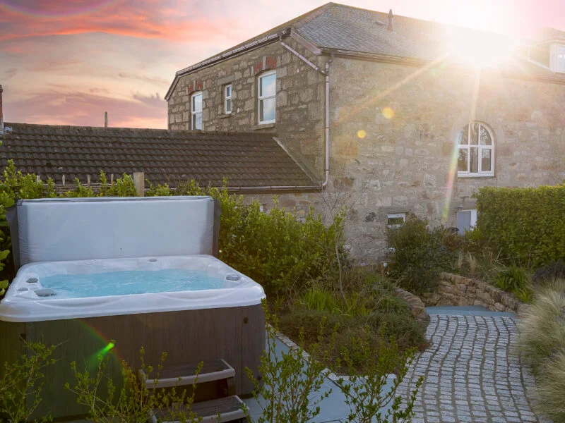 Sunset over the hot tub of Morwenna holiday cottage in St Ives