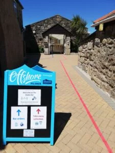 Signage at the entrance of Polmanter Touring Park's Stable Bar explaining the coronavirus safety precautions in place