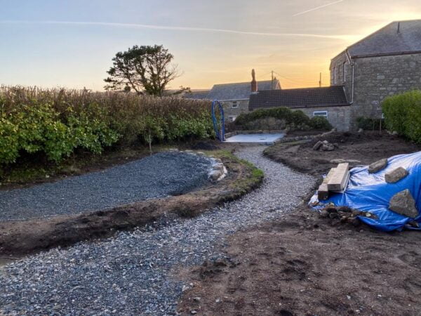 Sunset view of the landscaped garden in process at the Polmanter holiday cottage renovation