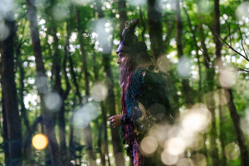 Actor in the woods performing theatre in St Ives