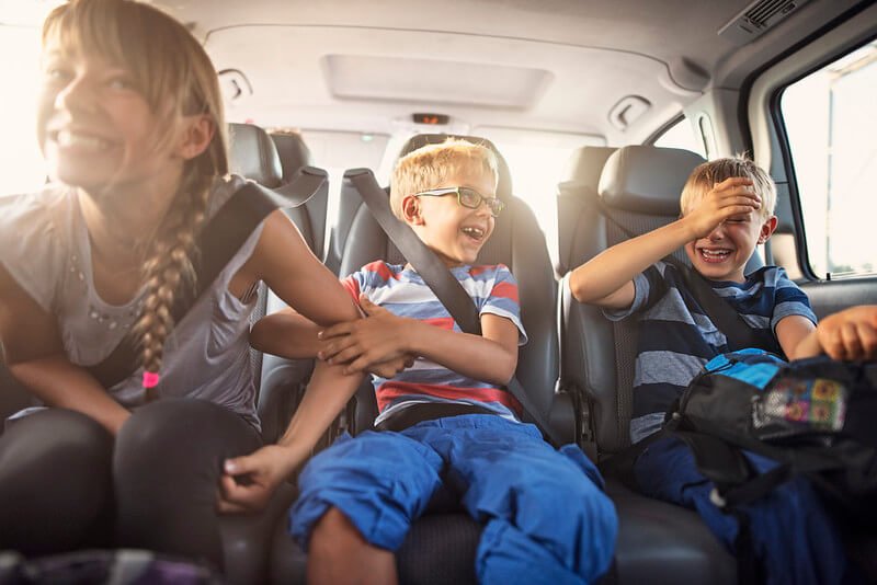 Three children sat in the car travelling to Cornwall